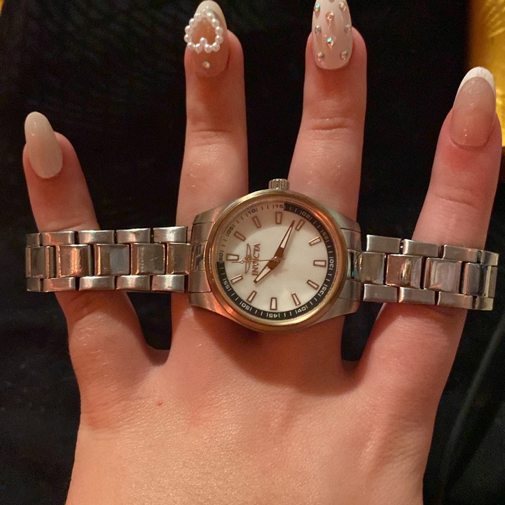 Invicta women’s silver watch with rose gold and pearl accents